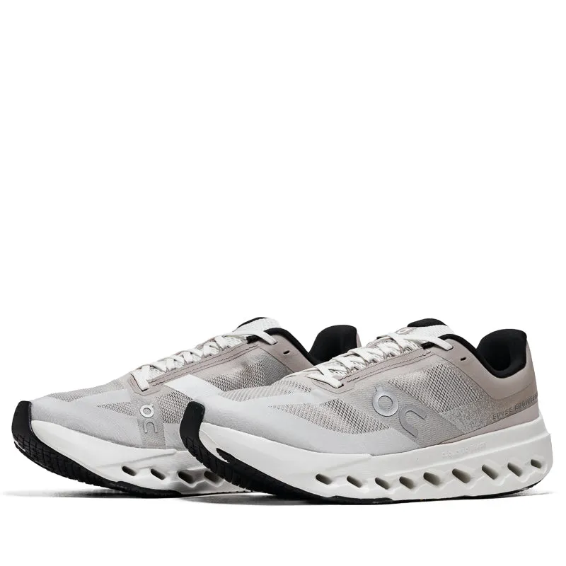 On Cloudsurfer Next - Fog/Ivory running on ice shoes